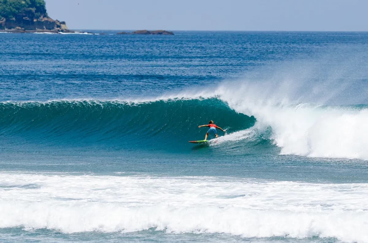 Surfer @carlitos-ayala rides a perfect right-hand wave at Colorados.