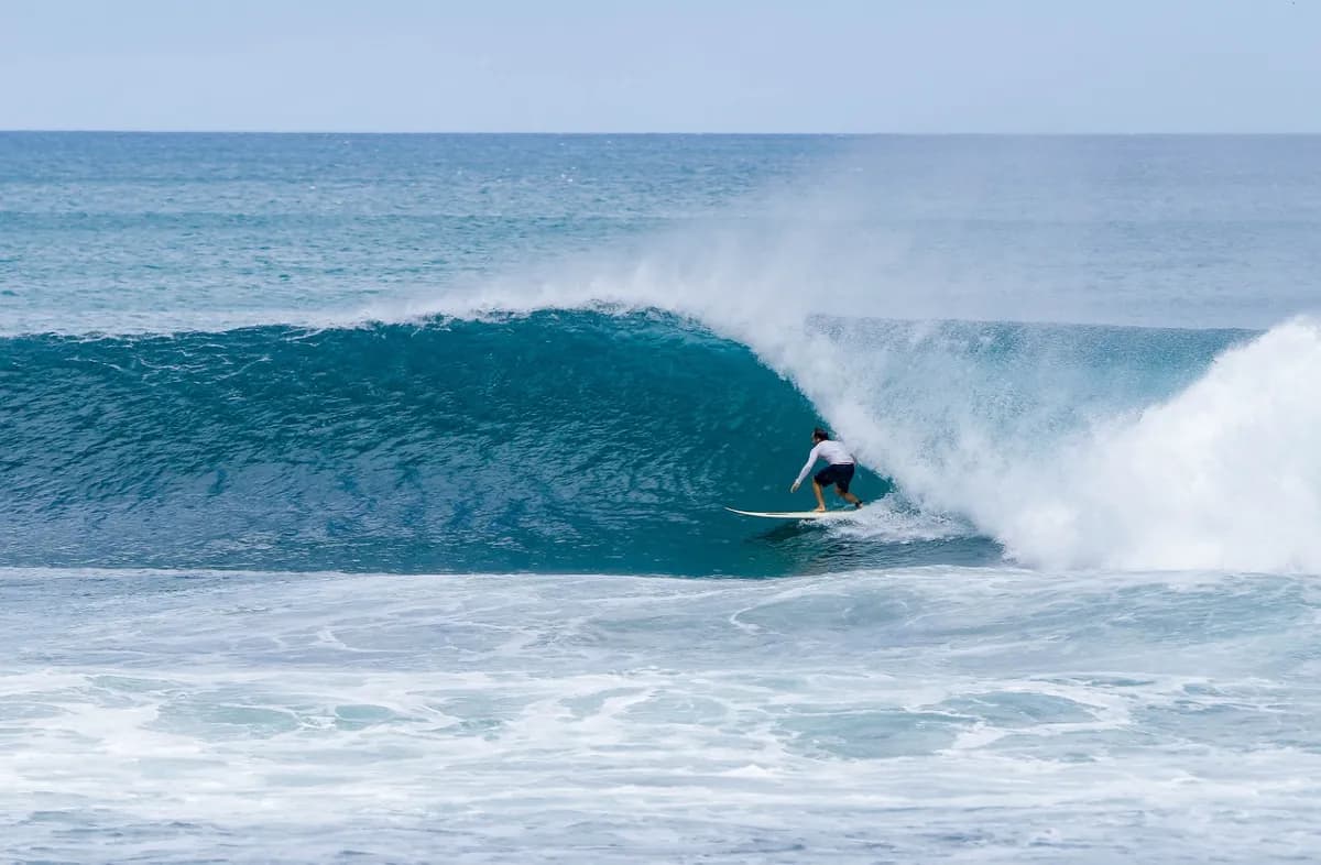 Surfer @juan-pablo-reyes deep in a perfect barrel ride.