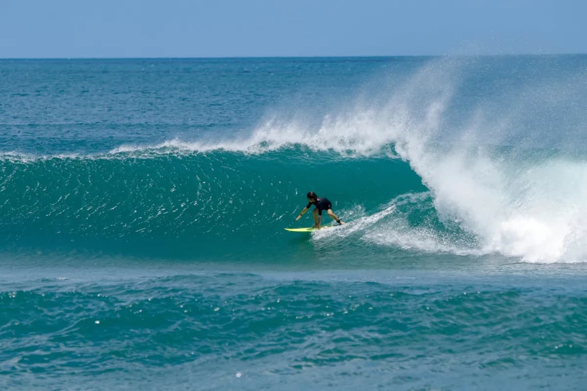 Romano Menichetti gracefully riding inside a clean barrel.