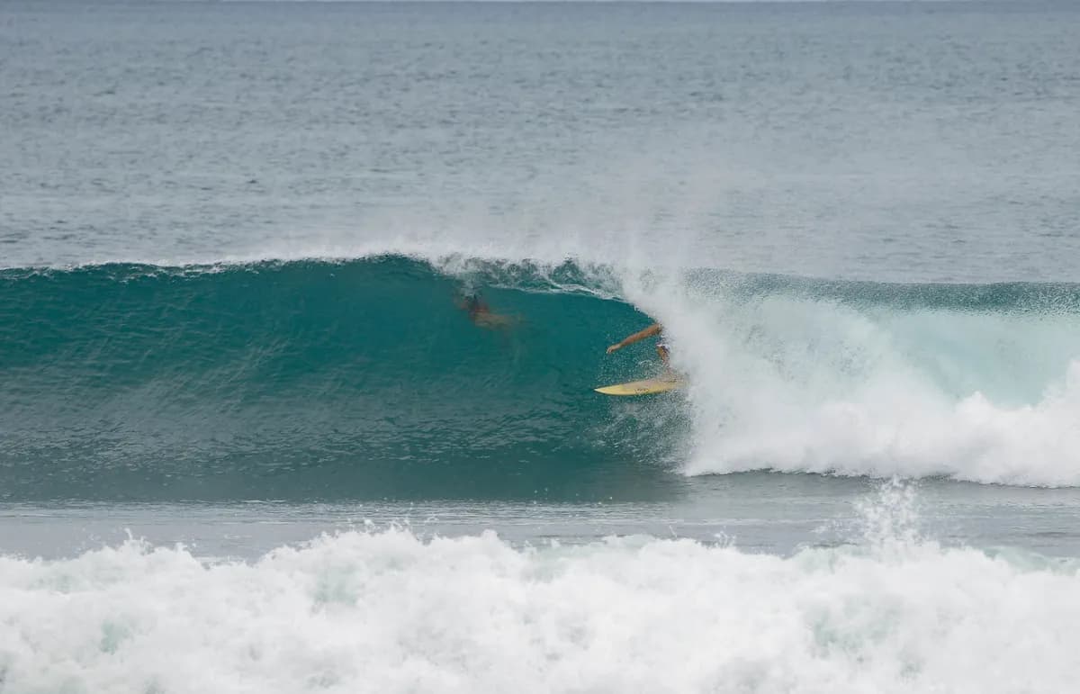 Surfer dario-romo rides inside a perfect barrel at Playa Colorado.