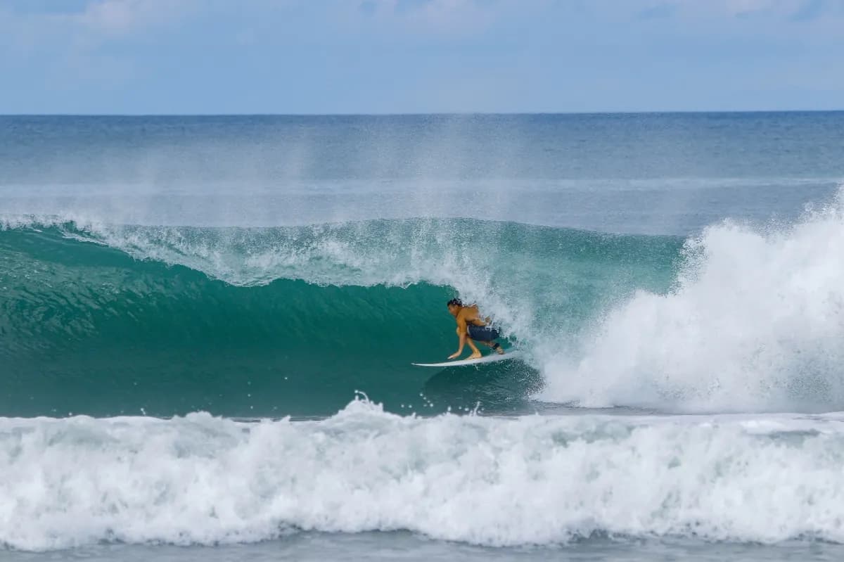 Surfer @yujiharrison tucked inside a perfect barrel.