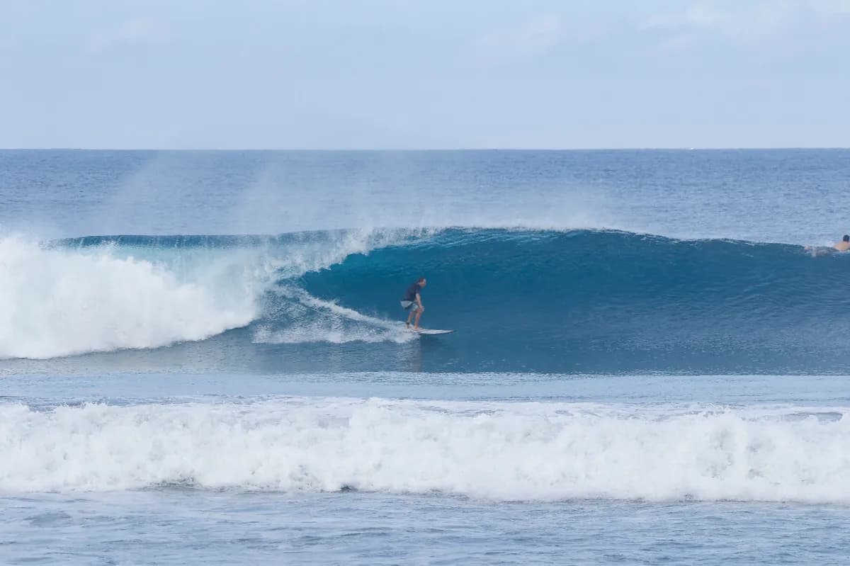 Surfer catches a perfect right-hand barrel at Playa Colorado.