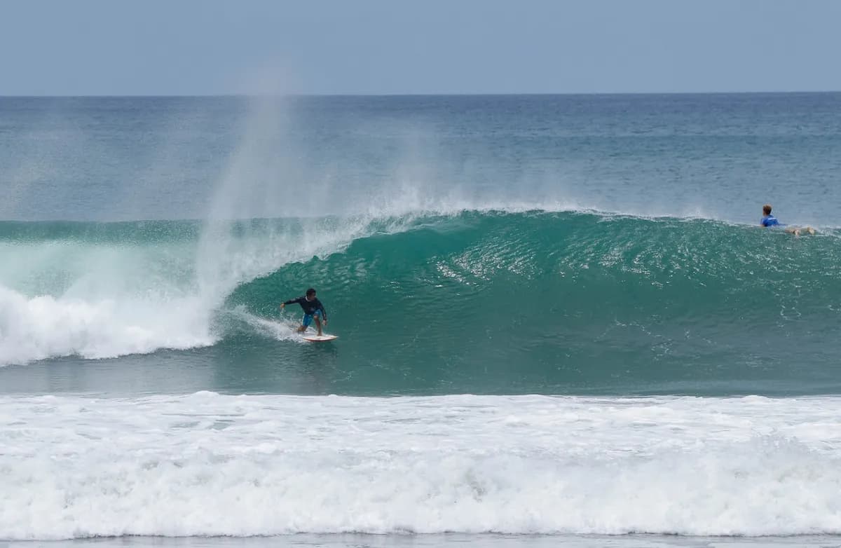 Surfer rides a clean right-hand barrel at Playa Colorado.