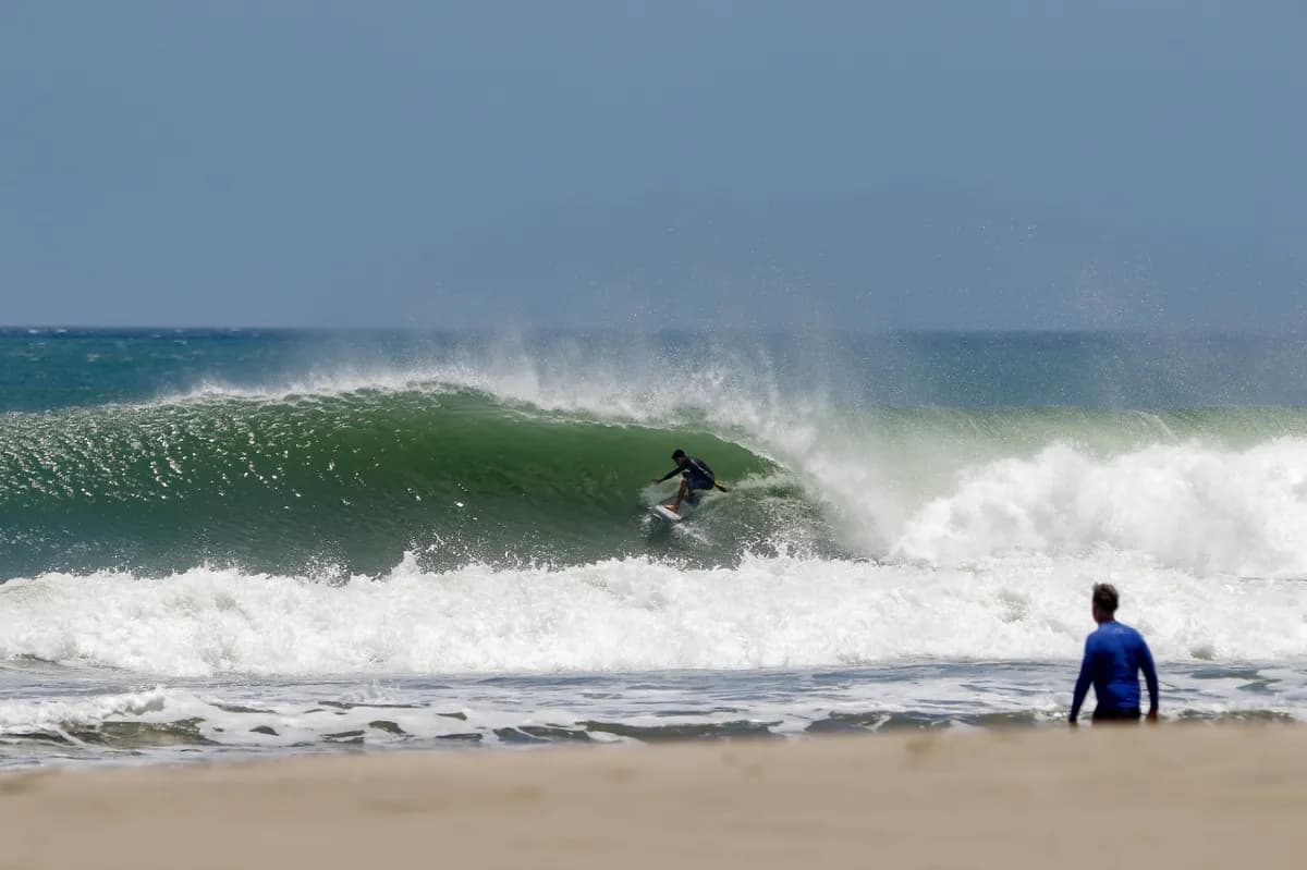 Surfer carves inside a perfect, hollow barrel at Colorados.
