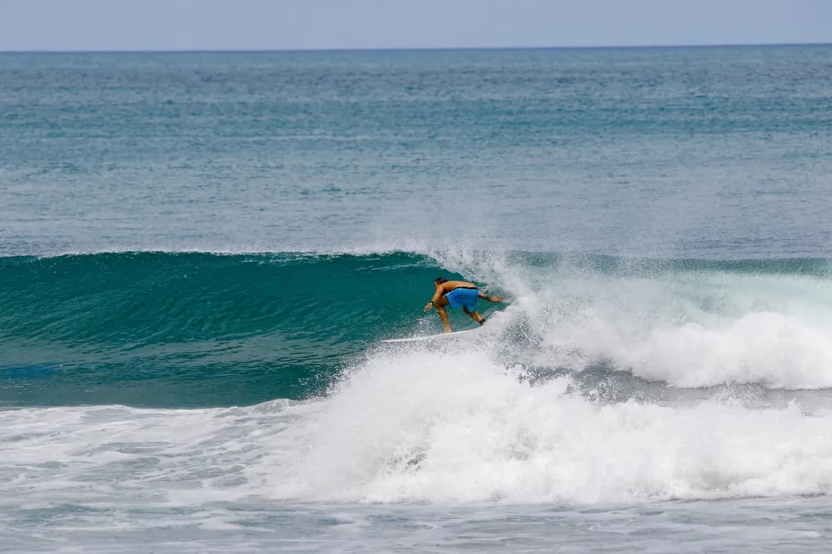 Surfer executes a precise cutback on a peeling wave.