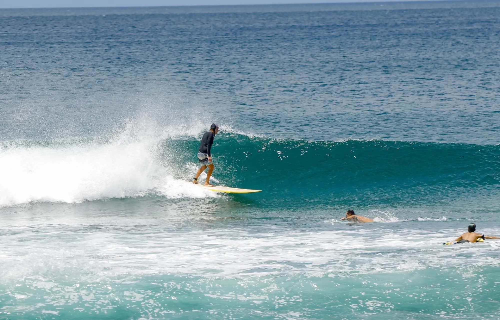 Surfer descends a right wave at Playa Colorado.